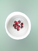 Pomegranate seeds in syrup