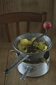 Mashing potatoes with a vegetable masher