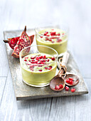 Cold cream of kale cabbage and avocado soup with pomegranates seeds
