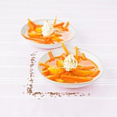 Carrot and orange soup with a touch of whipped cream