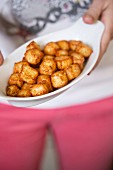 Diced and fried Queijo minas cheese