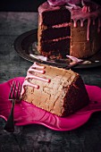 Chocolate layer cake topped with rose-flavored icing