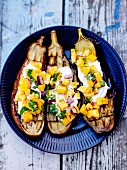 Roasted aubergines with Greek yoghurt and mango salsa, red onions and coriander