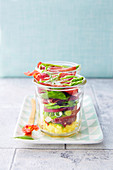 Grisons meat, green asparagus, beetroot and polenta salad jar