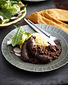 Italian black pudding with lentils and mashed potatoes