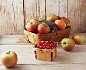 Cranberries and apples in baskets