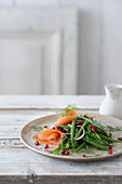 Green bean, pomegranate seed and smoked salmon salad