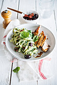 Tagliatelles with ricotta, spinach, sun-dried tomatoes and olives, roasted turkey breasts