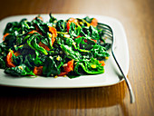 Cooked spinach with confit tomatoes