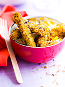 Indian-style breaded chicken fingers, rice duo