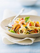 Tagliatelles with mussels, shrimps and thinly chopped vegetables