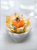 Diced smoked salmon, lime and pink pepper whipped cream in a filo pastry nest