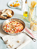 Spaghetti with cherry tomatoes, garlic, thyme and parmesan (vegetarian)
