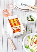 Cream cheese terrine with red and yellow peppers