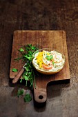 Fennel carpaccio with orange and shrimps on a bed of potato-carrot mash