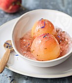 Poached pears in rose jelly, Herbes de Provence and borage flowers