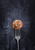 Mediterrenean lamb and raisin meatballs on a fork