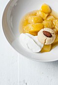 Cinnamon-flavored and tonka bean Beurré-Hardy stewed pears, whipped cream, almond biscuits and white wine coulis