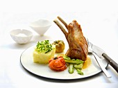 Loin of lamb with orange butter, vegetables and mashed potatoes