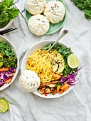 Noodle bowl with vegetables and Chinese vegan dumplings