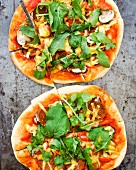 Mushroom and rocket lettuce pizzas