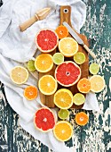 Mixed citrus fruit halves on a chopping board