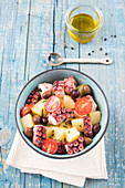 Potato, octopus, olive and cherry tomato salad