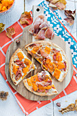 Pumpkin, goat's cheese and raw ham flaky pastry pie