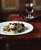 Grilled aubergine salad with pine nuts