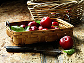 Plums in basket