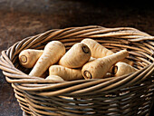 Wicker basket with mini parsnips