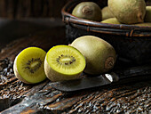 Sliced kiwi with a fruit knife