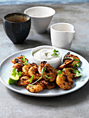 Indonesian-style king prawns with coriander and lime yoghurt sauce