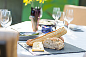 Bread and cheese on an outdoor table