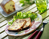 Slices of fig, raw ham and goat's cheese savoury cake