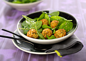 Baby spinach salad with cod and sesame fishballs
