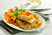 Trout fillet in oat flake crust, thinly striped carrots with parsley