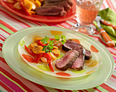 Lamb fillet with cumin, steamed carrots and red peppers