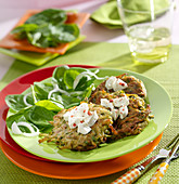 Zucchini patties with goat cheese and spinach shoots