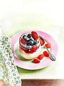 Fromage blanc with blueberries, strawberries, tagada strawberry sweets and summer fruit coulis