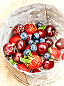 Bowl of cherries, strawberries and blueberries