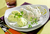 Hake fillets with creamy herb sauce,chervil cream potato quenelles
