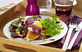 Toasted White Bread Topped With A Poached Egg,Red Wine And Shallot Sauce,Rocket Lettuce And Beetroot