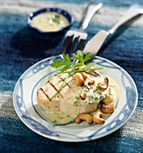 Grilled swordfish with coconut and herb sauce and cashews