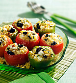 Tomatoes stuffed with bulgur, feta, pine nuts and black olives
