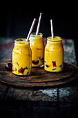Mango and turmeric smoothie with cherries