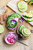 Beetroot cream cheese and sliced avocado open sandwiches