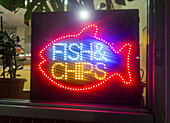 Neon advert for a fish & chip restaurant