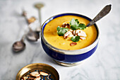 Pumpkin soup with roasted almonds and parsley