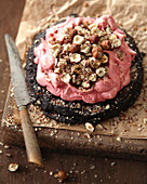 Black meringue, raspberry mousse and hazelnut Pavlova